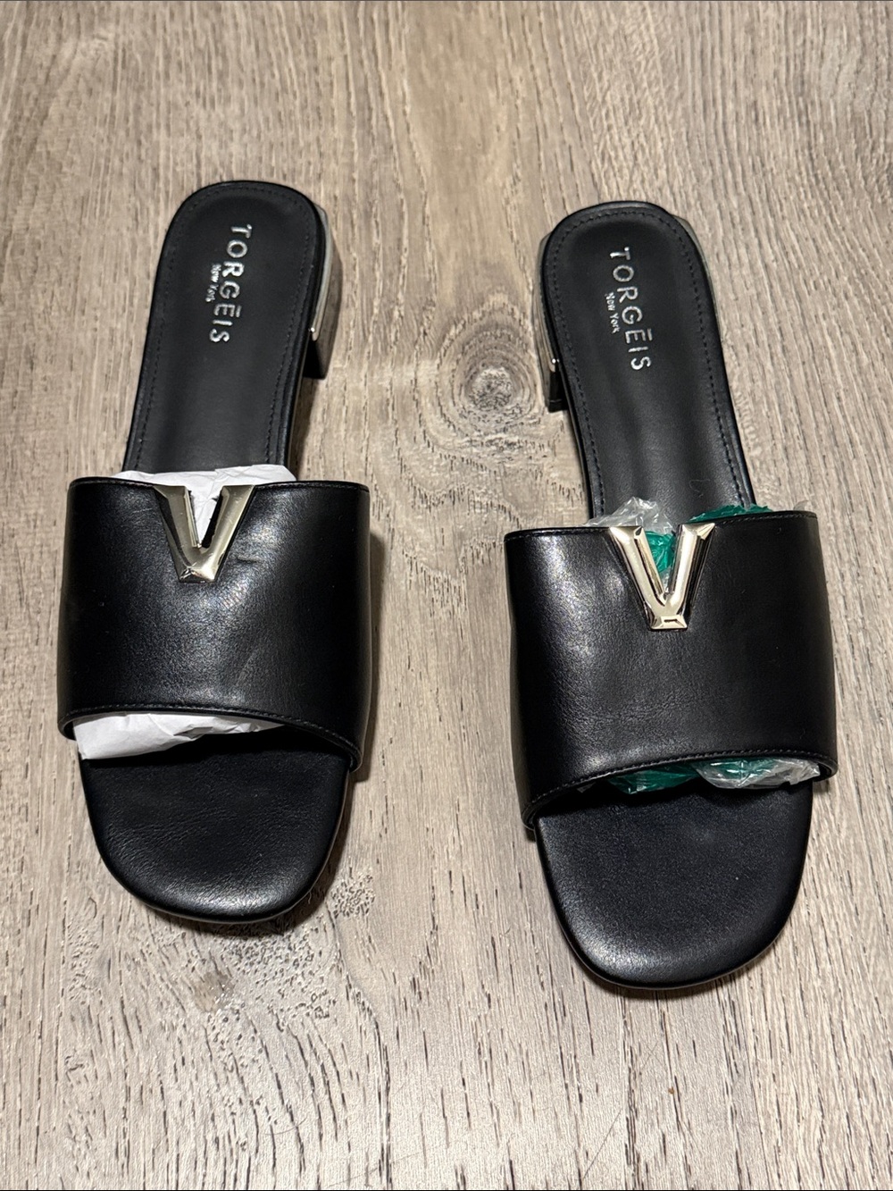 Torgeis Black Slip-On Mules with Gold V Accent